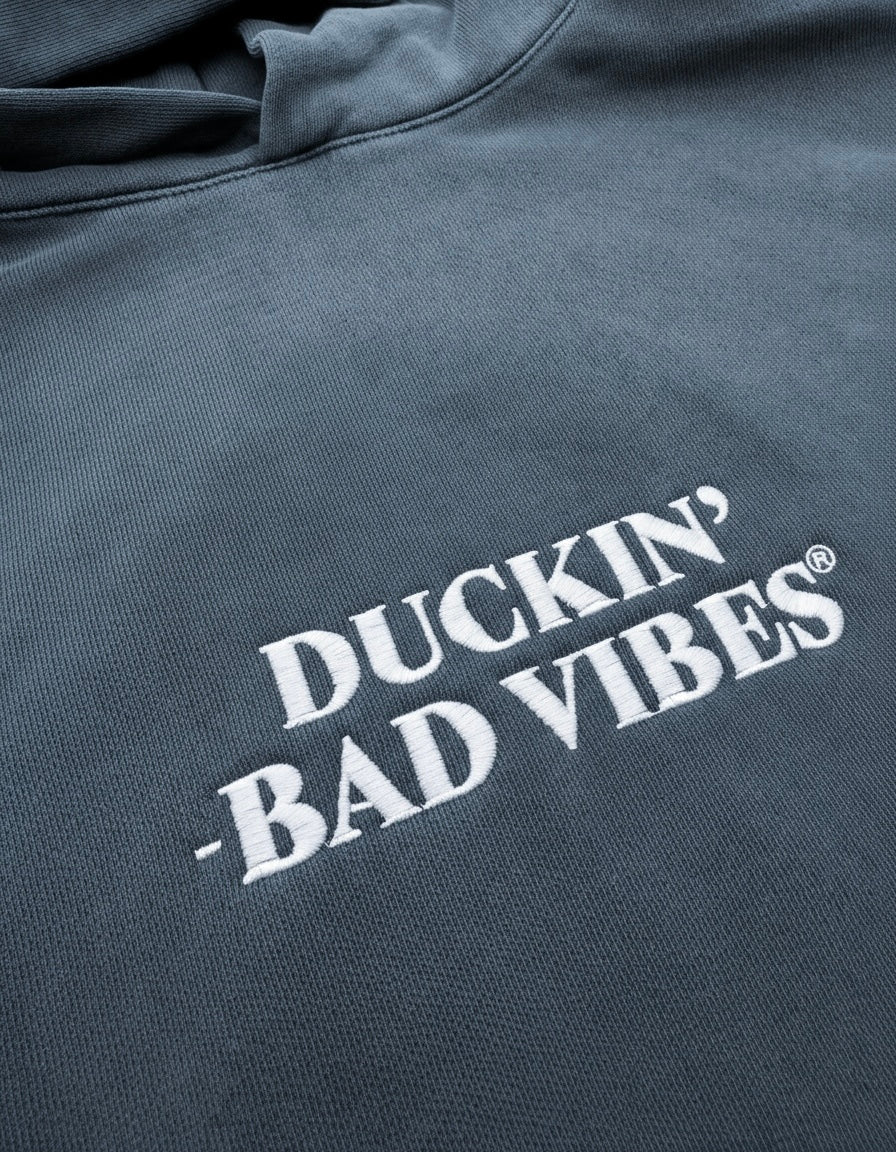 DUCKIN BAD VIBES CENTER LOGO   EMBROIDERED PREMIUM HOODIE (STONE BLUE)