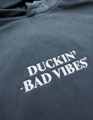 DUCKIN BAD VIBES CENTER LOGO   EMBROIDERED PREMIUM HOODIE (STONE BLUE)