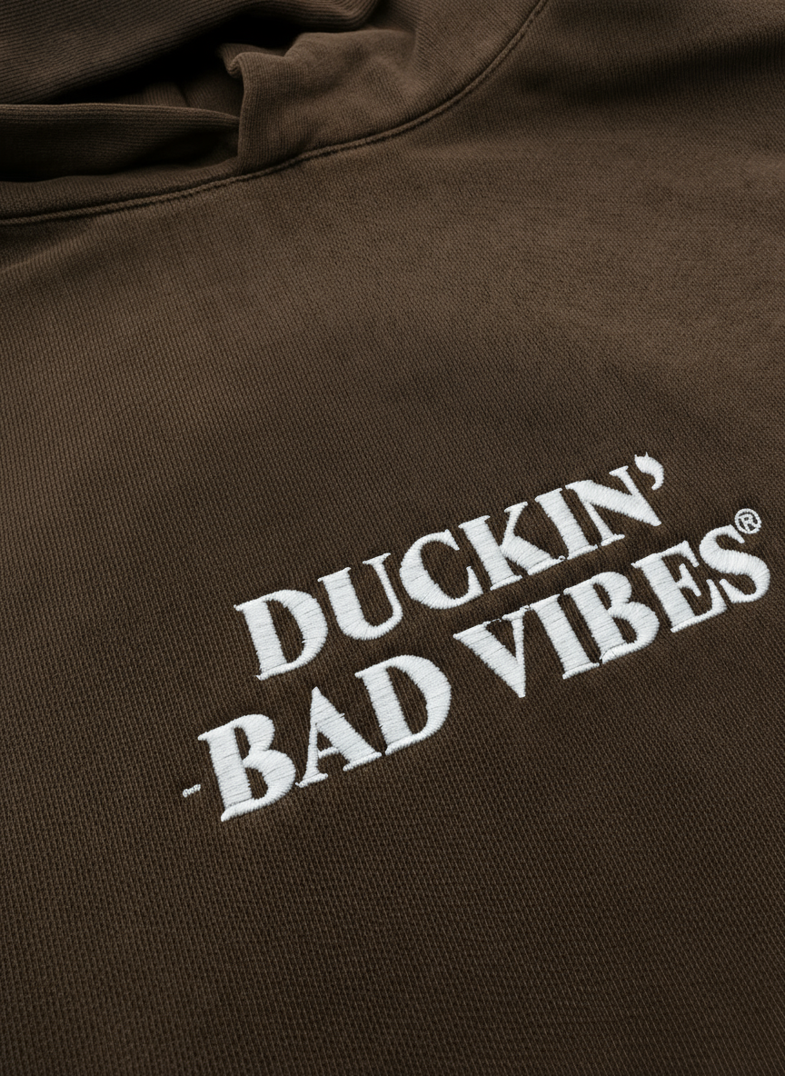 DUCKIN BAD VIBES CENTER LOGO   EMBROIDERED PREMIUM HOODIE (BROWN)